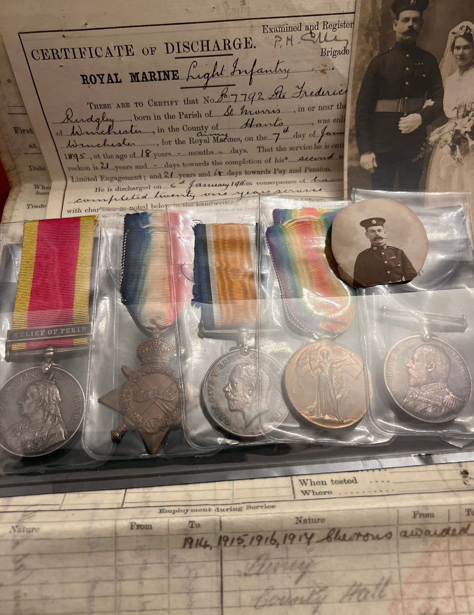 Group to 7792 Pte. F. Rudgley, Royal Marine Light Infantry, served 1895 to 1927, LSGC Edward VII, named China Medal NL. Depot WEi.Hai.WEi. (scarce), HMS Iron Duke 1914-17, then HMS President III (DEMS) 1918-27, with original service papers & wedding photo