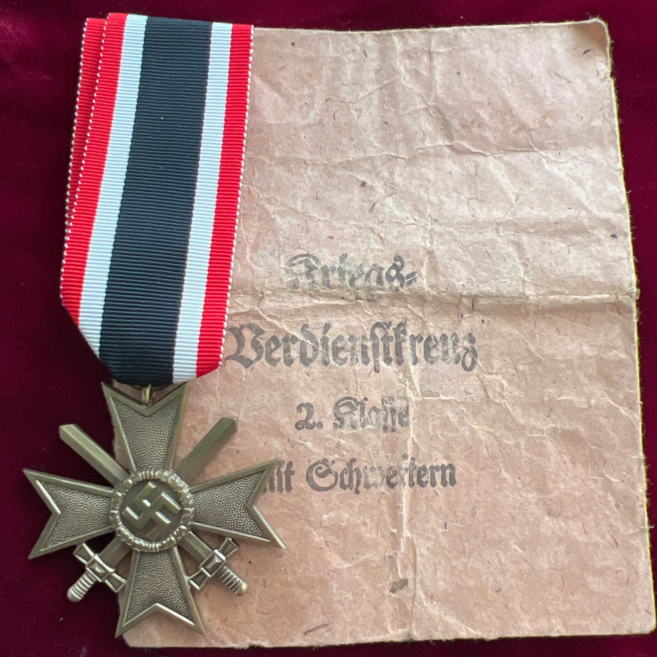 Nazi Germany, War Merit Cross, with original packet of issue, this a bit worn, medal a mint example with full ribbon