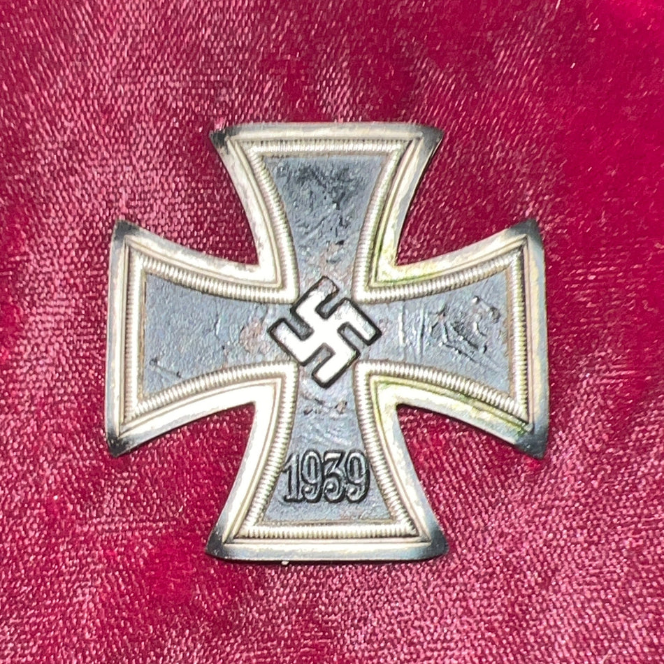 Nazi Germany, Iron Cross, 1st class, maker marked number 26, an interesting example with points curved to edges of cross, some wear