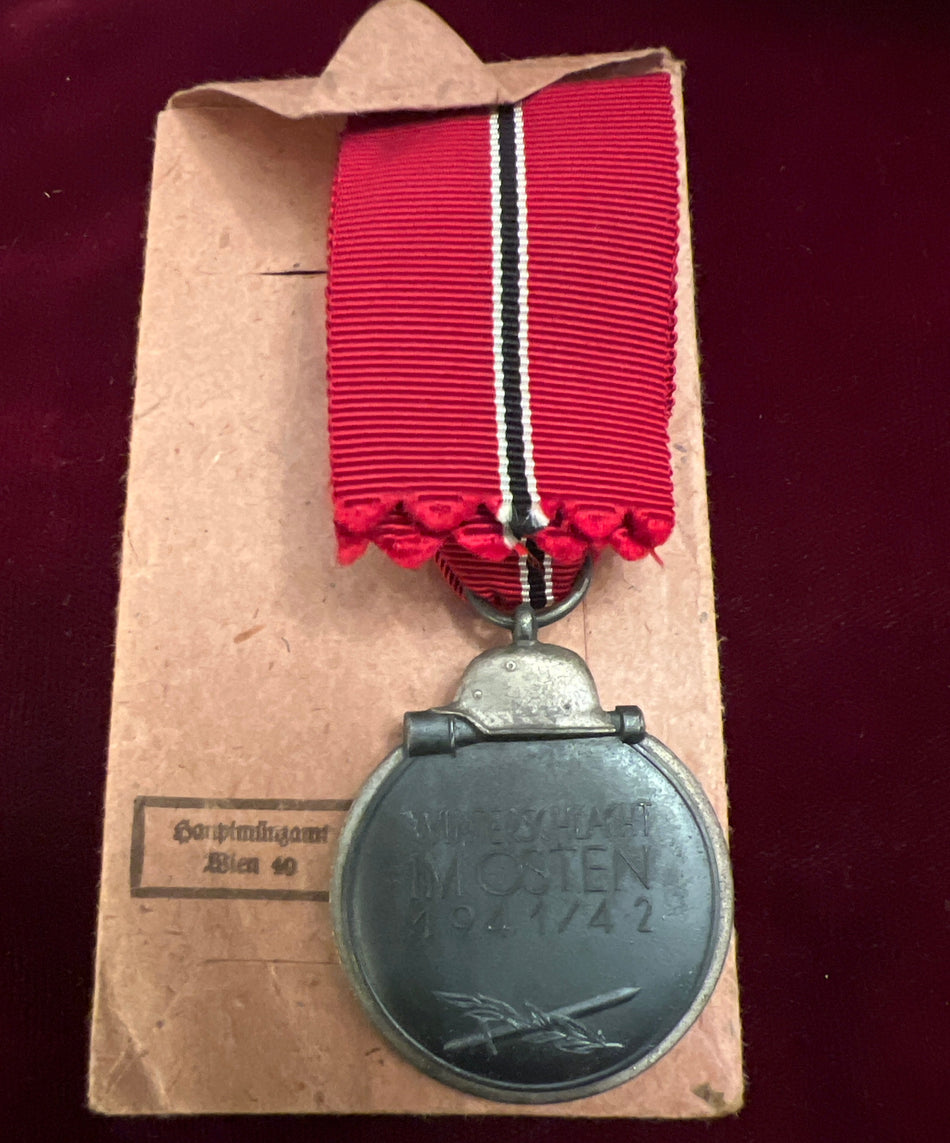 Nazi Germany, Russian Front Medal 1914-42, maker marked number 93, with original packet of issue and full length ribbon