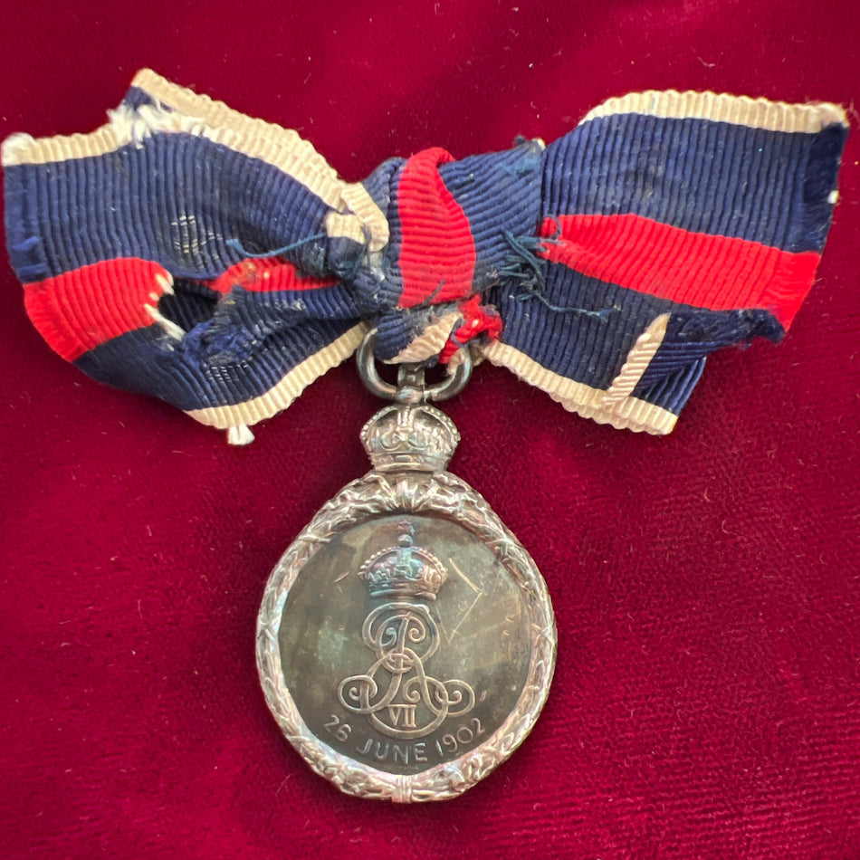 King Edward VII Coronation Medal in silver, 1902, on ladies bow