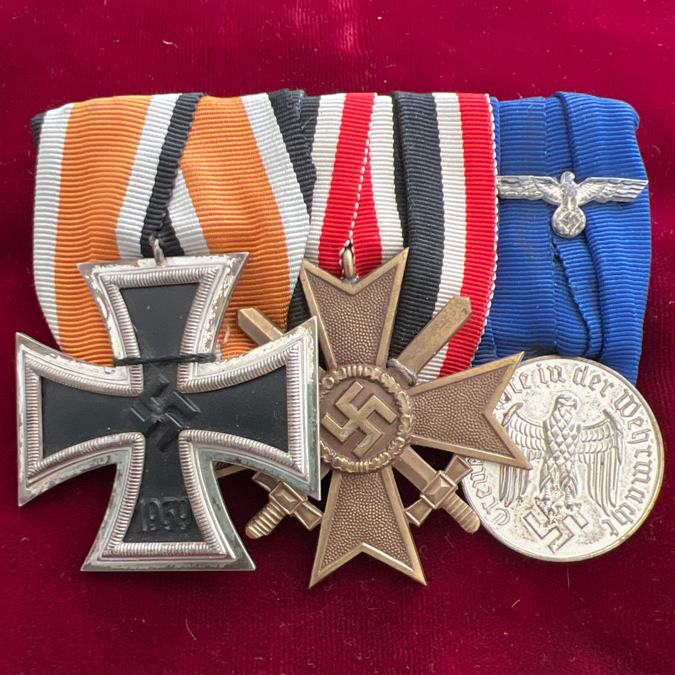Nazi Germany, group of 3: Iron Cross 2nd class, War Merit Cross with Swords & Armed Forces 4 Years Long Service Medal, all in good condition