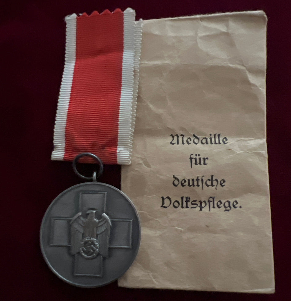 Nazi Germany, Social Welfare Medal, early type, with original packet of issue, scarce