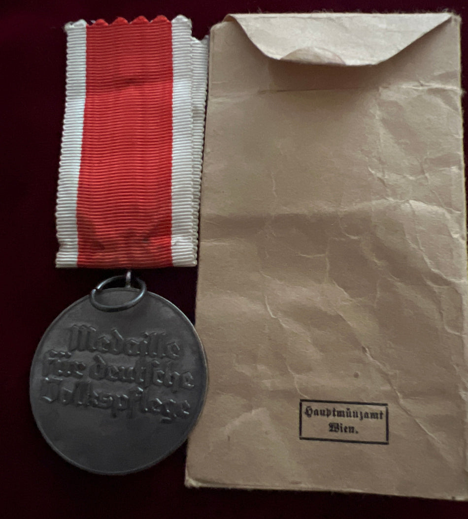 Nazi Germany, Social Welfare Medal, early type, with original packet of issue, scarce