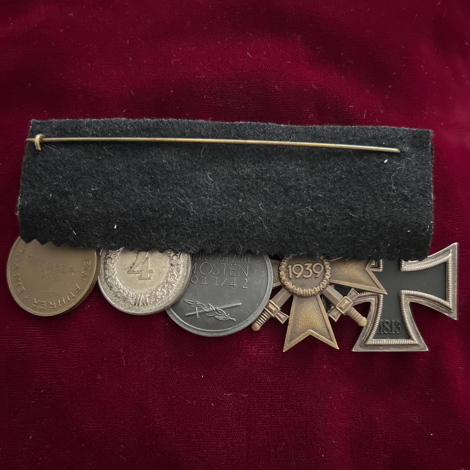 Nazi Germany, group of five: Iron Cross, War Merit Cross, Russian Front Medal, 4-Year Long Service Medal with Luftwaffe emblem, and Entry into Czechoslovakia Medal with small Prague bar, some wear