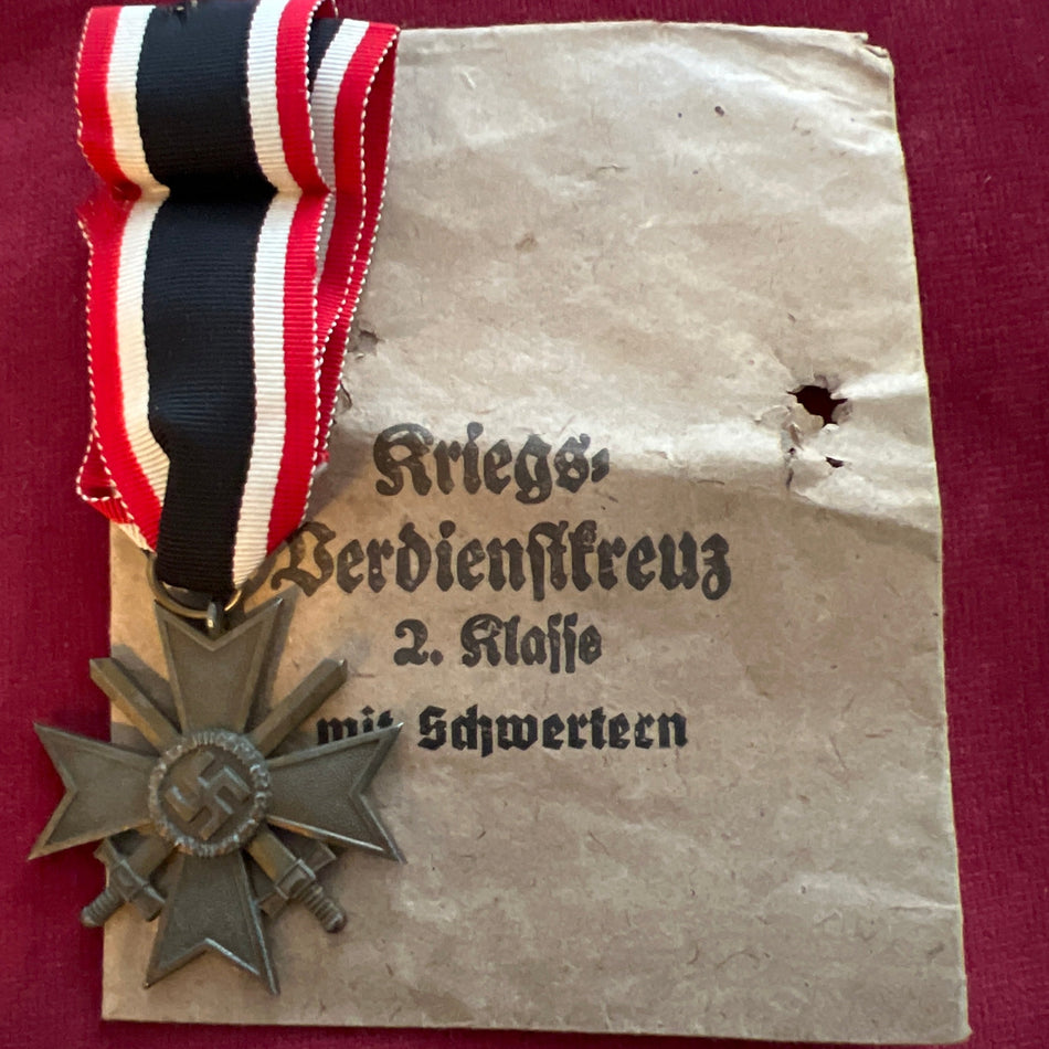 Nazi Germany, War Merit Cross 1939-45, maker marked no.4, with scruffy packet of issue