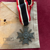 Nazi Germany, War Merit Cross 1939-45, maker marked no.4, with scruffy packet of issue