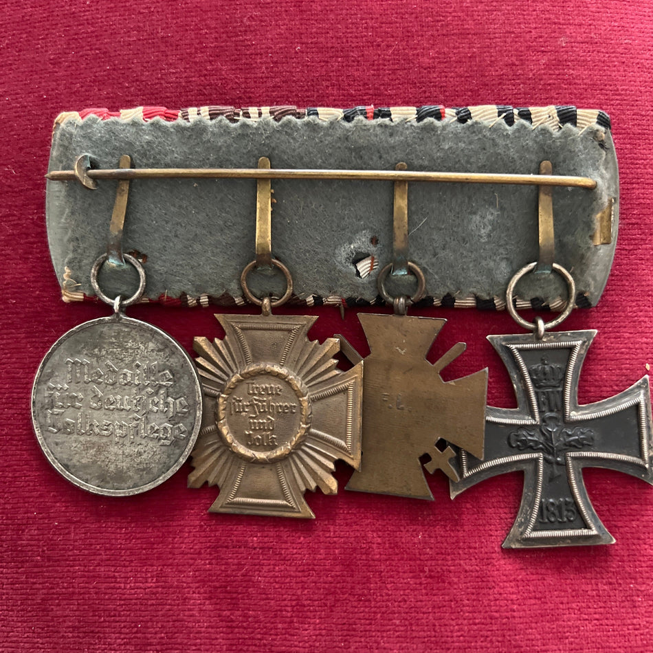 Imperial/ Nazi Germany, group of 4: Iron Cross 1914-18, Cross of Honour, Nazi Party Long Service Medal in bronze & a Nazi Social Service Medal, an interesting combination