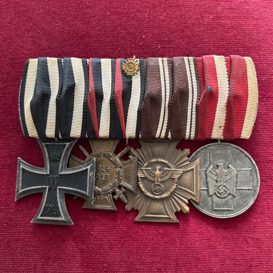 Imperial/ Nazi Germany, group of 4: Iron Cross 1914-18, Cross of Honour, Nazi Party Long Service Medal in bronze & a Nazi Social Service Medal, an interesting combination