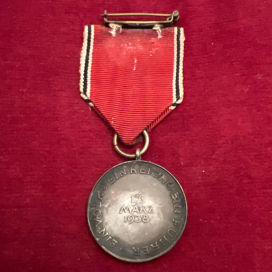 Nazi Germany, Entry into Austria Medla, 1938, toned with age, complete with pin