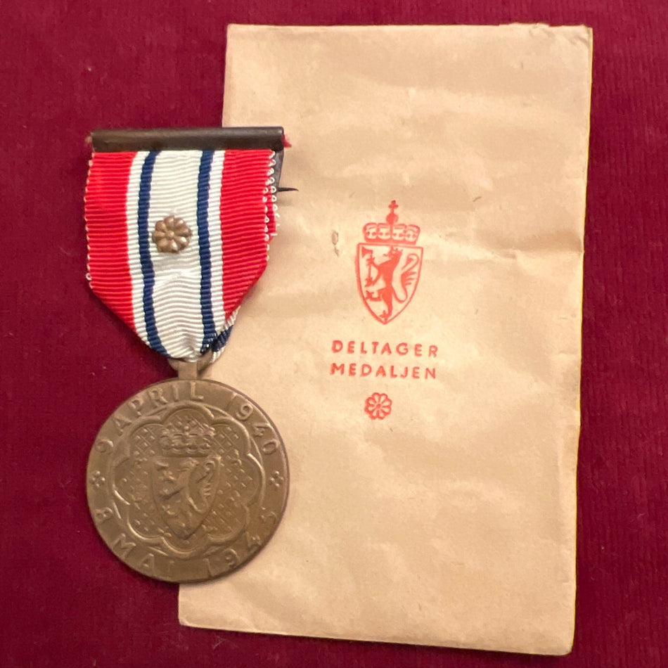 Norway, Defence Medal 1940-45, rosette on ribbon, with original packet