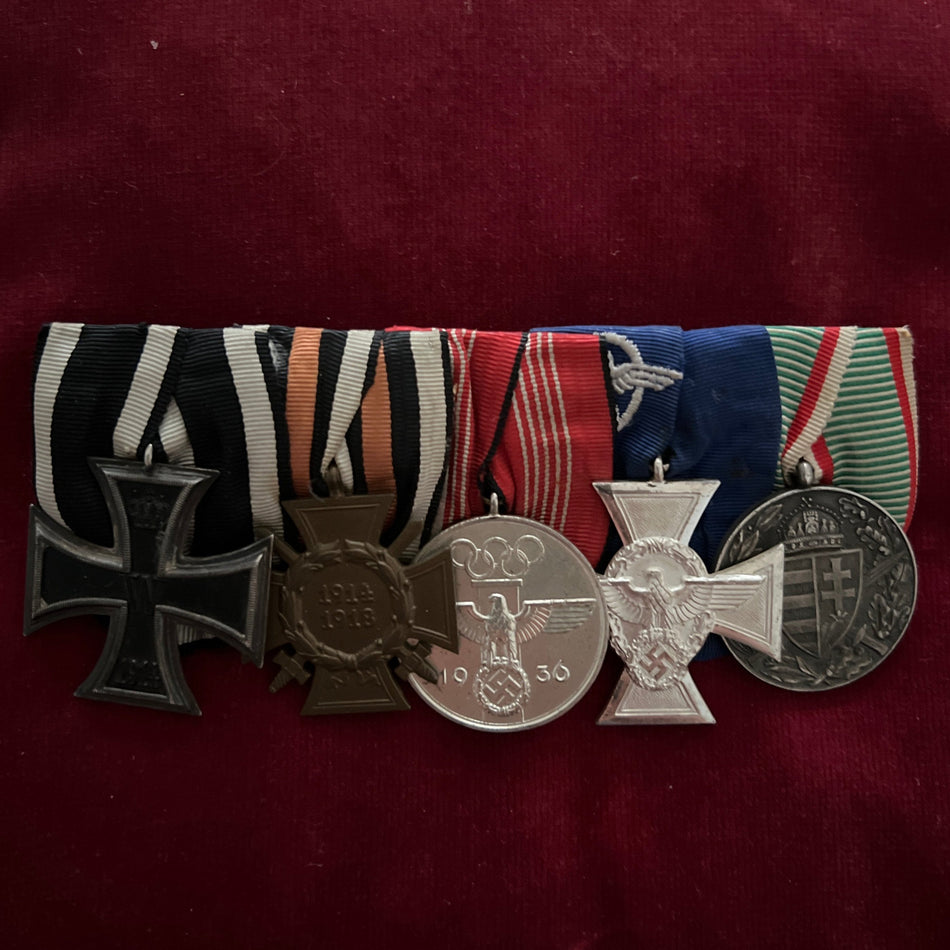 Germany, group of 5: Iron Cross 1914-18, Cross of Honour 1914-18, German Olympic Decoration 1936 (Nazi), Police 18 Years Long Service Cross & Hungary War Cross 1914-18, all in good condition, with correct ribbon for police cross