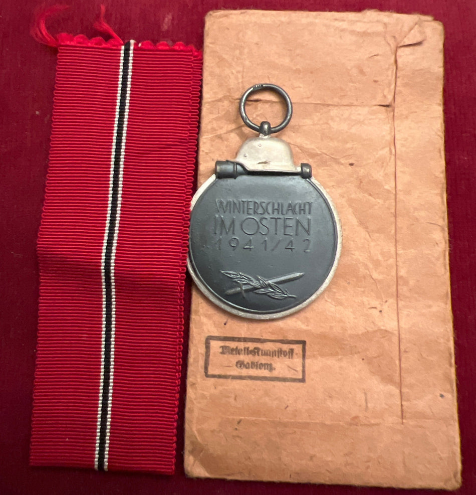 Nazi Germany, Russian Front Medal 1941-42, maker marked number 39, with original packet and ribbon