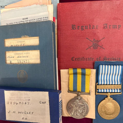 Korea pair to Gunner John Arthur Wigley, served WW2 with the Royal Army Ordnance Corps, War Medal listed in book, then Korea for 1 year, then Hong Kong with the Royal Artillery, then Merchant Navy, see service book, full history with original paperwork