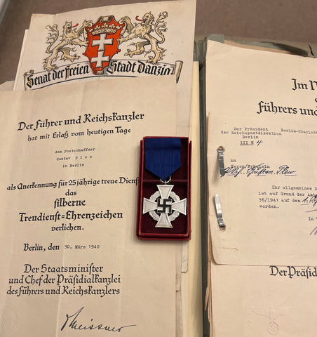 Nazi Germany, 25 Years Faithful Service Cross in box with papers, to Gustav Plew, served in the postal service 1922-71, love 50 years, first served in Danzig, then Berlin, awarded the 25 Years Service Cross 30th March 1940, a scarce & interesting lot