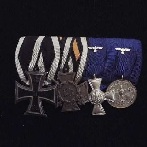 Imperial & Nazi German group of 4. Iron Cross 1914 (2nd class), Cross of Honour (1934), Army 18 Year Long Service (with eagle) & 4 Year Service Medal (with eagle) 3rd Reich issues