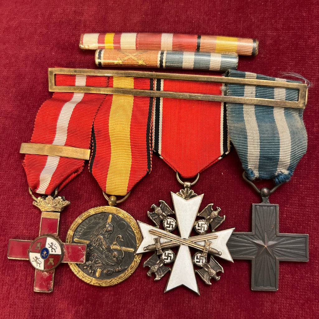 An interesting group of 4:  Spanish Cross of Merit 1936, Spanish Civil War Medal, Nazi Germany Eagle Order (no damage) & Italian Cross of Merit