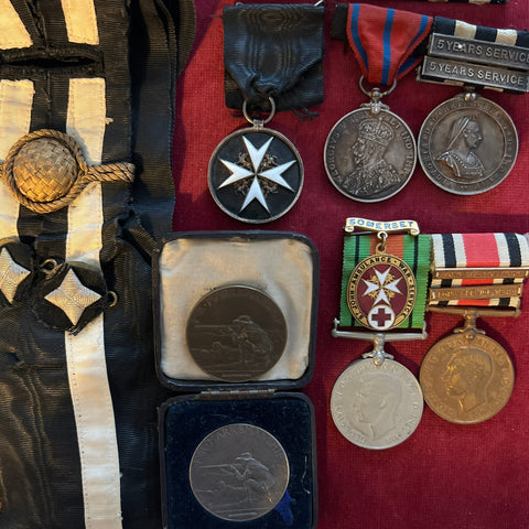 Father & Son medals. Father: Superintendant Alfred B. Moore, St John serving brother. Son: Lance Corporal R. C. E. Moore, St John Ambulance War Service Medal, Somerset bar & shooting medals. See description, an interesting lot