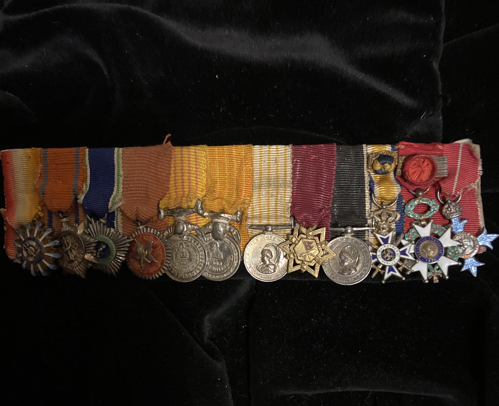 An interesting group of 12 miniature medals: 9 Gurkha medals, Dutch Order of Orange-Nassau, French Legion of Honour & Commander of the British Empire