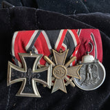 Germany, a scarce post-WW2 group mounted for wear after 1957: Iron Cross (WW2), War Merit Cross & Russian Front Medal