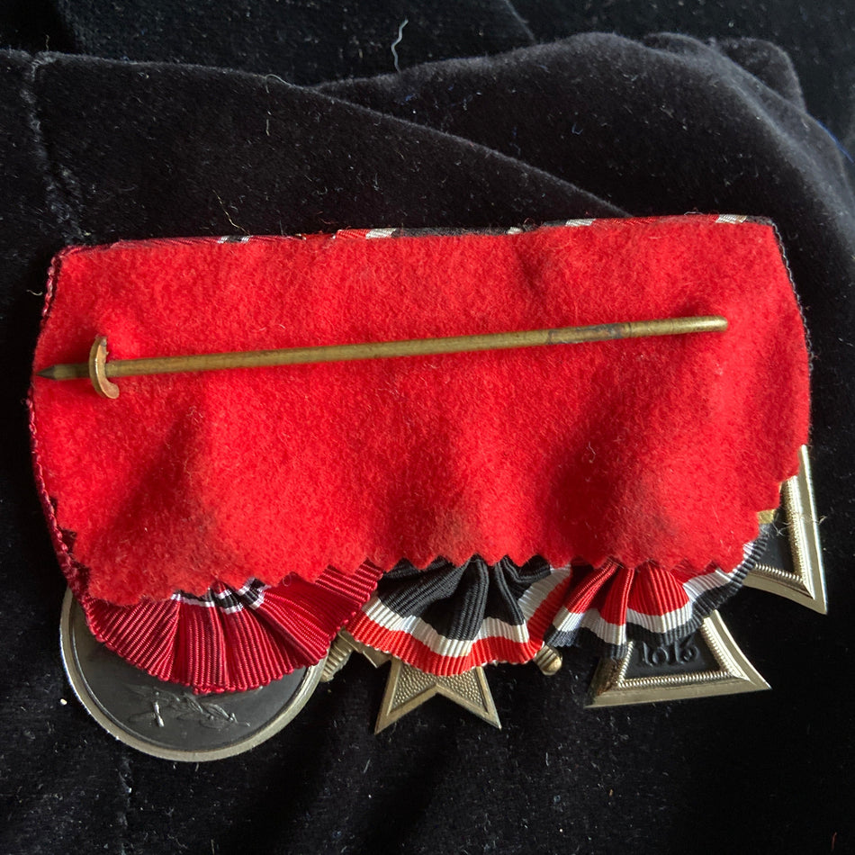 Germany, a scarce post-WW2 group mounted for wear after 1957: Iron Cross (WW2), War Merit Cross & Russian Front Medal