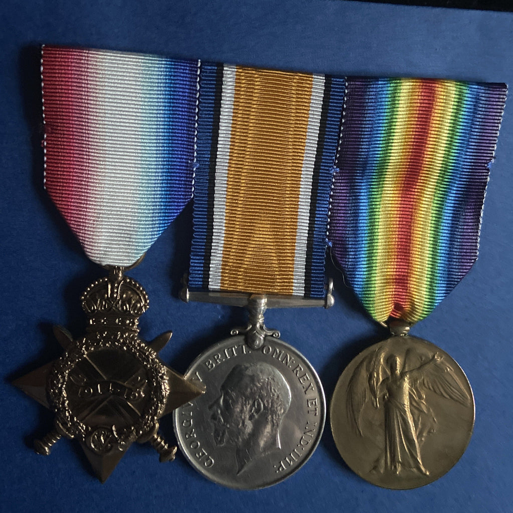 1914-15 Star trio to 11667 Pte. A. Kennelly, 1 Coldstream Guards, frostbite to feet, invalidated 31/3/1915, includes papers