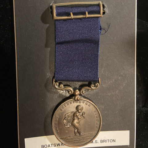 Royal Humane Society Medal, bronze, to Boatswain's Mate James Kennett, HMS Briton, Royal Navy, who dived overboard into shark-infested waters to save the life of Mr Boxer, who was insensible and sinking after the cutter had capsised, includes history